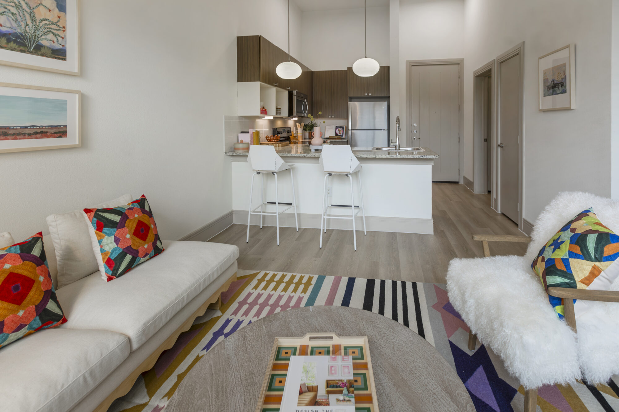 living room with bright decor with view of the kitchen